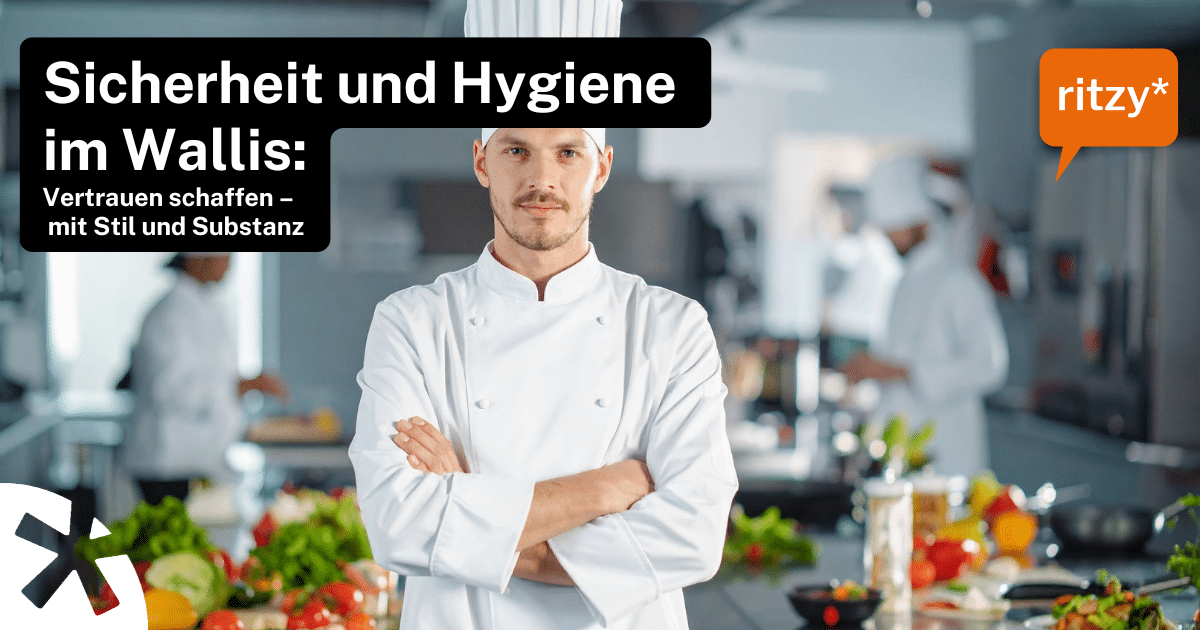 Koch in weisser Uniform steht mit verschränkten Armen in einer professionellen Küche, umgeben von frischem Gemüse und Kochutensilien. Text auf dem Bild: ‚Sicherheit und Hygiene im Wallis: Vertrauen schaffen – mit Stil und Substanz‘, Logo ritzy*